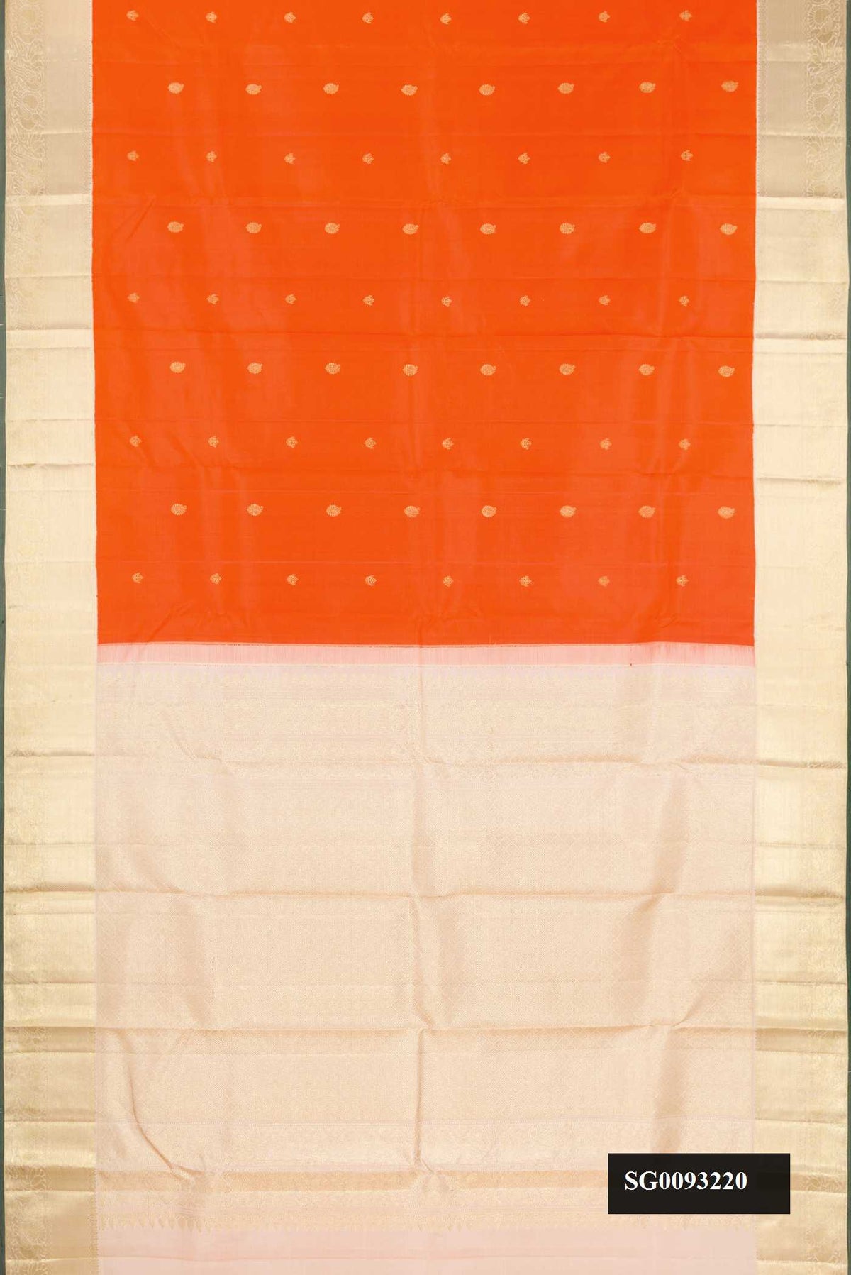 Orange Dual Tone Kanchipuram Silk Saree with Zari Butta on the body and Zari Border.  displayed on a mannequin