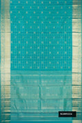 Peacock Blue Dual Tone Kanchipuram Silk Saree with Checked design on the body and Zari Border.  displayed on a mannequin