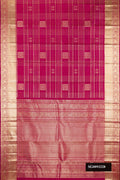 Magenta Dual Tone Kanchipuram Silk Saree with Checked design on the body and Fancy Border.  displayed on a mannequin