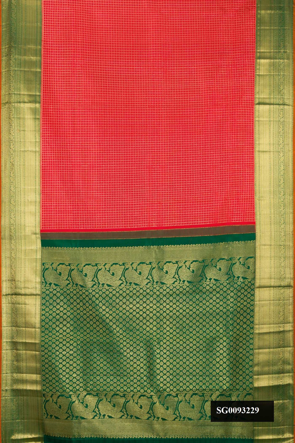 Red Dual Tone Kanchipuram Silk Saree with Checked design on the body and Zari Border.  displayed on a mannequin