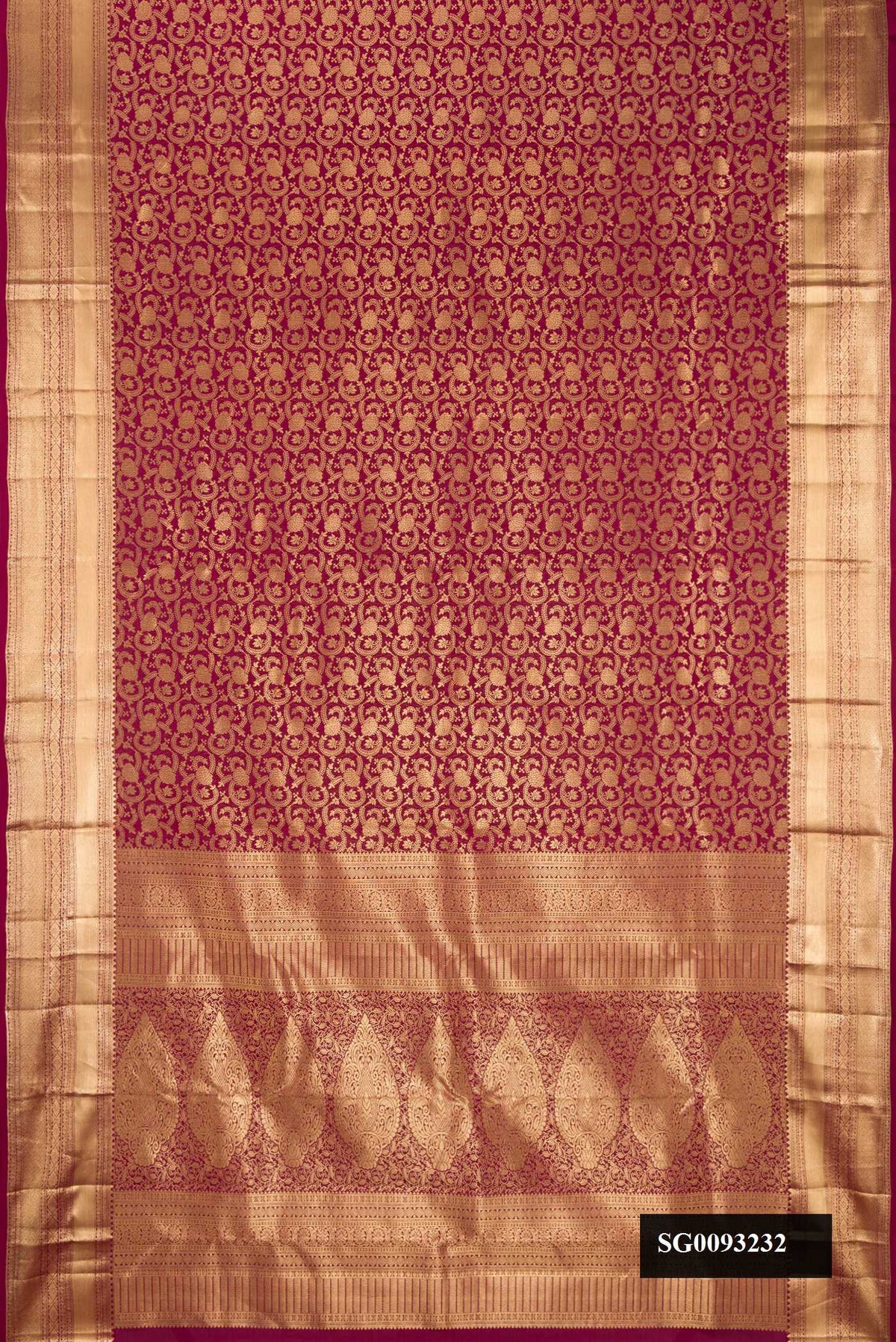 Maroon Dual Tone Kanchipuram Silk Saree with Zari Brocade on the body and Zari Border.  displayed on a mannequin