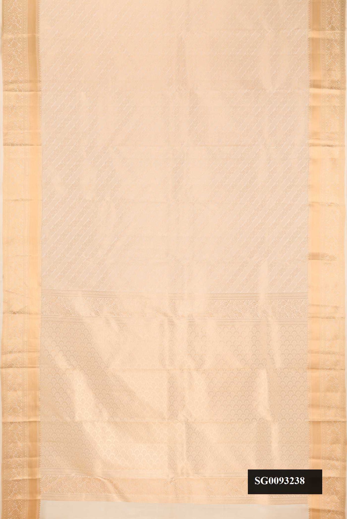 Beige Dual Tone Kanchipuram Silk Saree with Zari Brocade on the body and Zari Border.  displayed on a mannequin