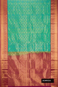 Sea Green Dual Tone Kanchipuram Silk Saree with Zari Brocade on the body and Zari Border.  displayed on a mannequin
