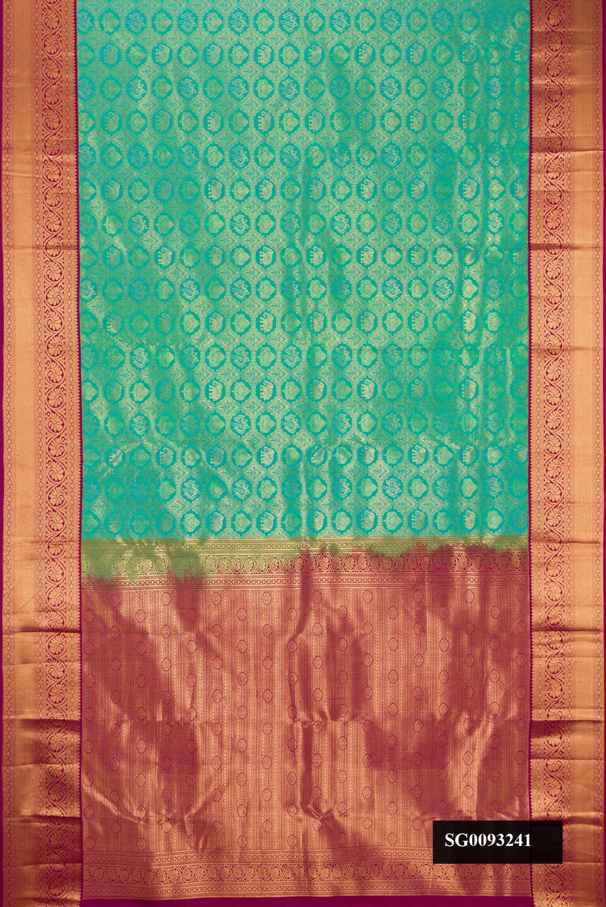Sea Green Dual Tone Kanchipuram Silk Saree with Zari Brocade on the body and Zari Border.  displayed on a mannequin