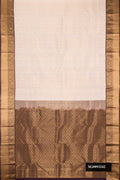 Off White Dual Tone Kanchipuram Silk Saree with Zari Brocade on the body and Zari Border.  displayed on a mannequin