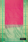 Magenta Dual Tone Kanchipuram Silk Saree with Zari Brocade on the body and Zari Border.  displayed on a mannequin