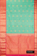 Sea Green Dual Tone Kanchipuram Silk Saree with Zari Butta on the body and Zari Border.  displayed on a mannequin