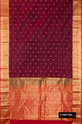 Maroon Dual Tone Kanchipuram Silk Saree with Zari Butta on the body and Zari Border.  displayed on a mannequin