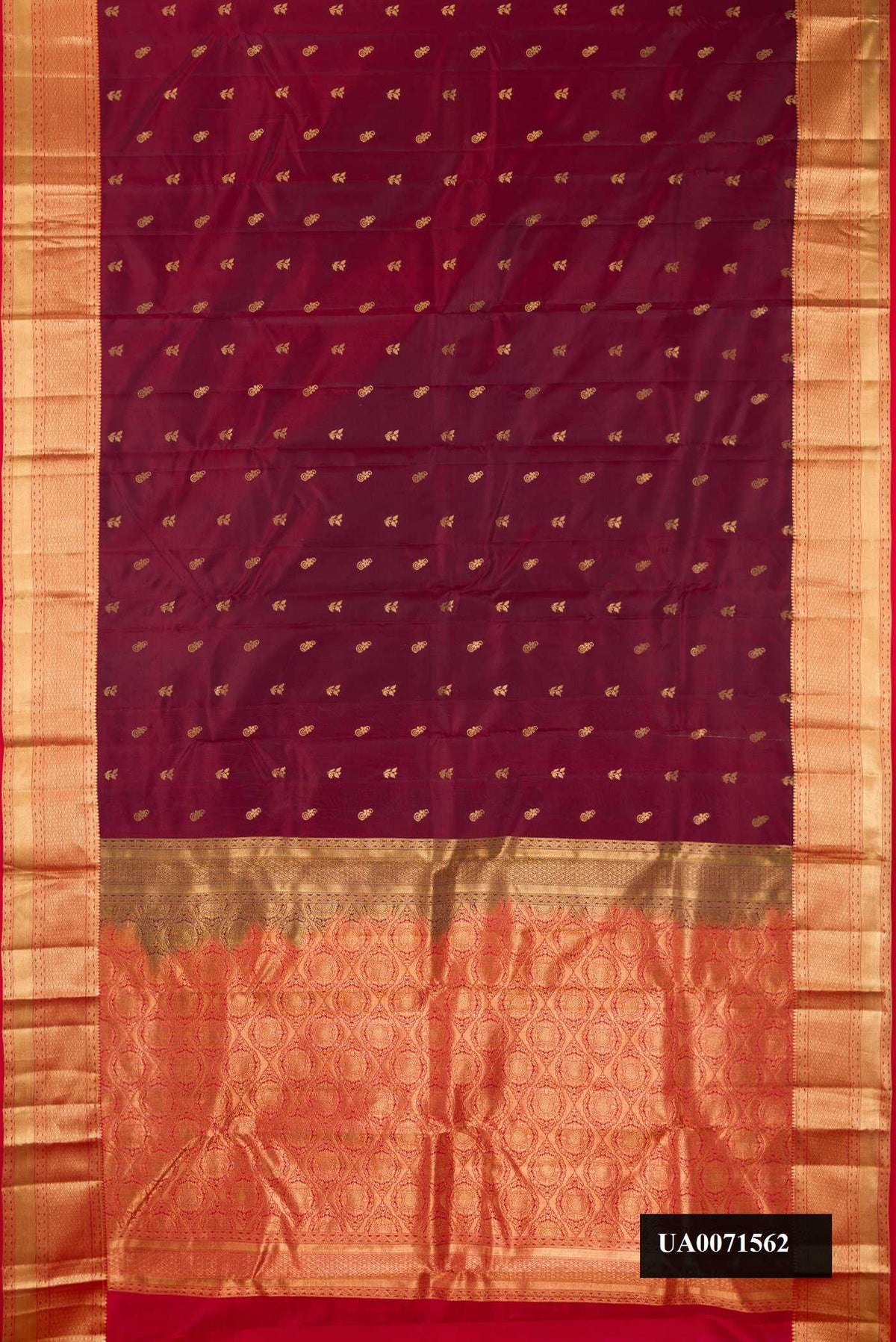Maroon Dual Tone Kanchipuram Silk Saree with Zari Butta on the body and Zari Border.  displayed on a mannequin