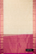 Off White Dual Tone Kanchipuram Silk Saree with Zari Butta on the body and Zari Border.  displayed on a mannequin