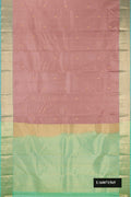 Rose Gold Dual Tone Kanchipuram Silk Saree with Zari Butta on the body and Zari Border.  displayed on a mannequin