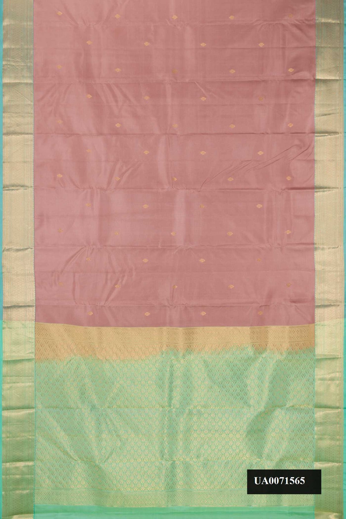 Rose Gold Dual Tone Kanchipuram Silk Saree with Zari Butta on the body and Zari Border.  displayed on a mannequin