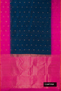 Navy Blue Dual Tone Kanchipuram Silk Saree with Zari Butta on the body and Fancy Border.  displayed on a mannequin