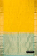 Yellow Dual Tone Kanchipuram Silk Saree with Zari Butta on the body and Zari Border.  displayed on a mannequin