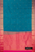 Peacock Blue Dual Tone Kanchipuram Silk Saree with Zari Butta on the body and Zari Border.  displayed on a mannequin