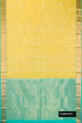Lemon Yellow Dual Tone Kanchipuram Silk Saree with Zari Butta on the body and Zari Border.  displayed on a mannequin