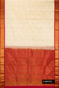 Sandal Dual Tone Kanchipuram Silk Saree with Zari Butta on the body and Zari Border.  displayed on a mannequin
