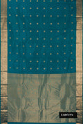 Peacock Blue Dual Tone Kanchipuram Silk Saree with Zari Butta on the body and Zari Border.  displayed on a mannequin