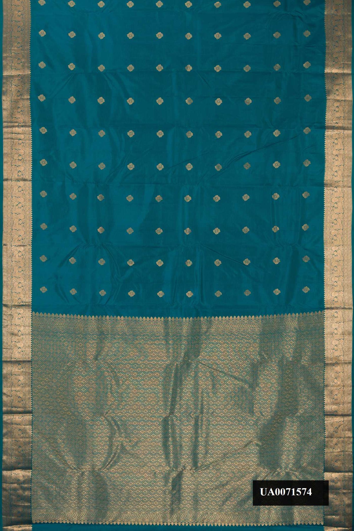 Peacock Blue Dual Tone Kanchipuram Silk Saree with Zari Butta on the body and Zari Border.  displayed on a mannequin