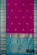 Magenta Dual Tone Kanchipuram Silk Saree with Zari Butta on the body and Zari Border.  displayed on a mannequin