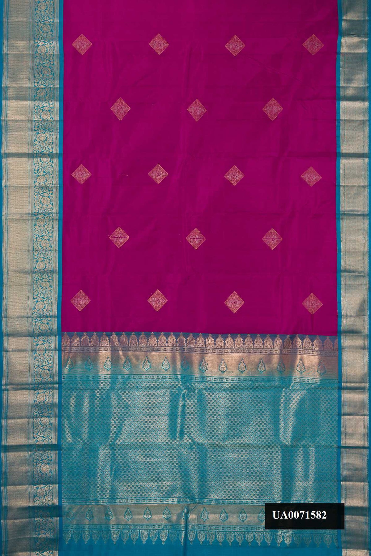 Magenta Dual Tone Kanchipuram Silk Saree with Zari Butta on the body and Zari Border.  displayed on a mannequin
