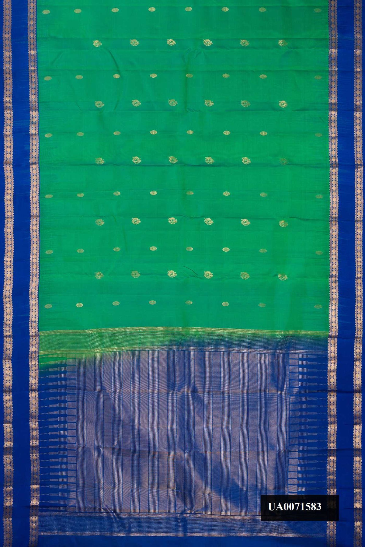 Green Dual Tone Kanchipuram Silk Saree with Zari Butta on the body and Zari Border.  displayed on a mannequin
