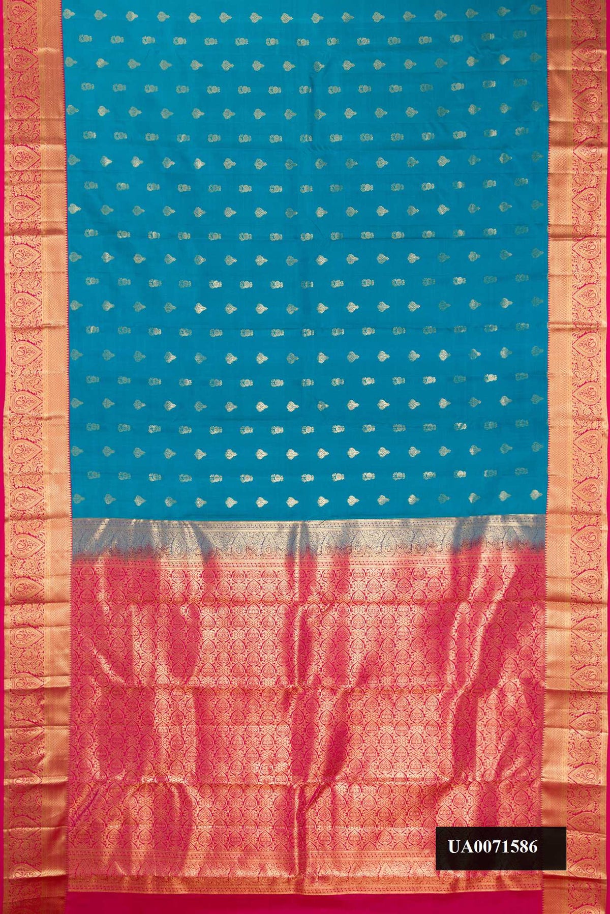 Sky Blue Dual Tone Kanchipuram Silk Saree with Zari Butta on the body and Zari Border.  displayed on a mannequin
