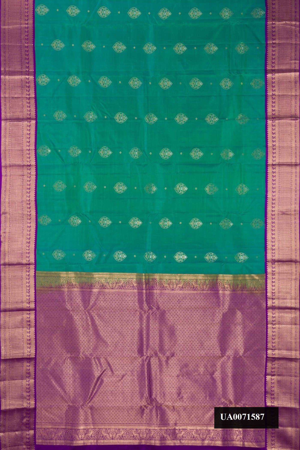 Sea Green Dual Tone Kanchipuram Silk Saree with Zari Butta on the body and Zari Border.  displayed on a mannequin