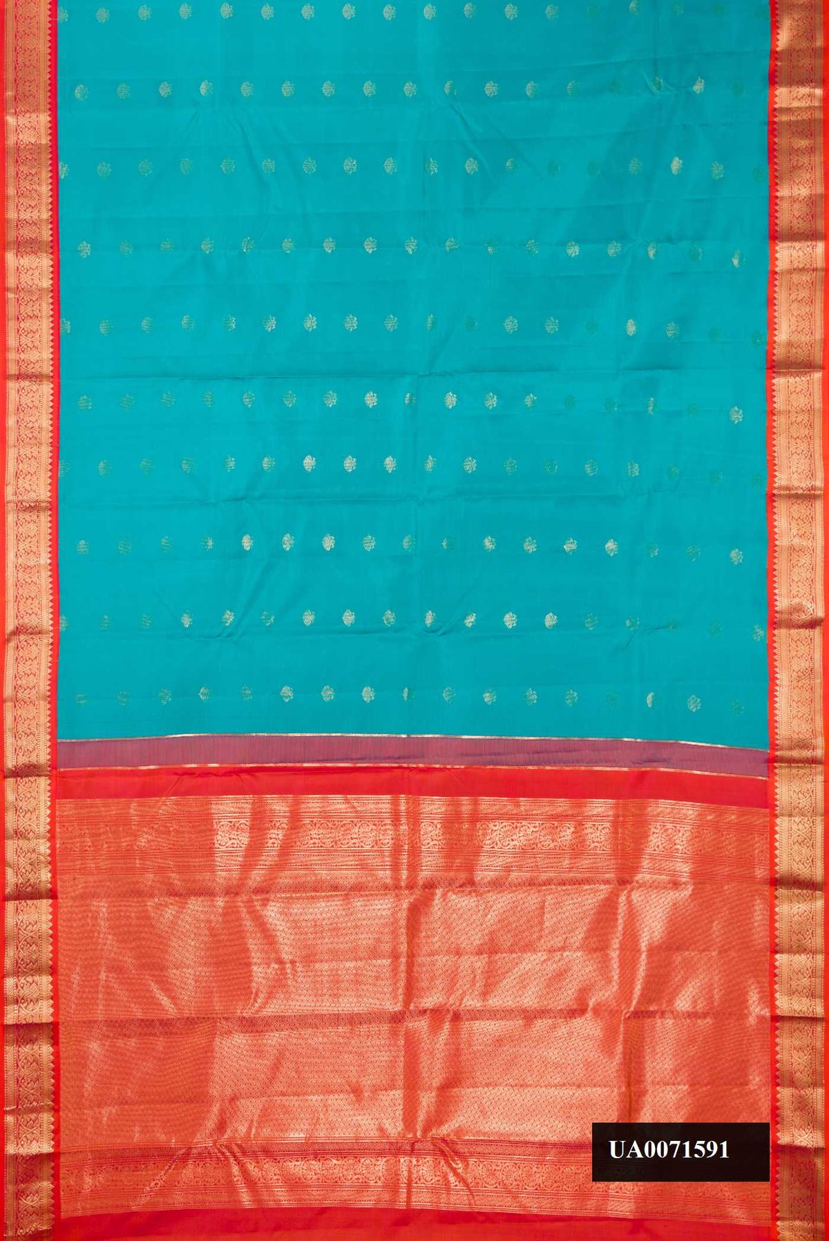 Sky Blue Dual Tone Kanchipuram Silk Saree with Zari Butta on the body and Zari Border.  displayed on a mannequin