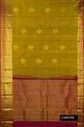 Mehandi Green Dual Tone Kanchipuram Silk Saree with Zari Butta on the body and Zari Border.  displayed on a mannequin