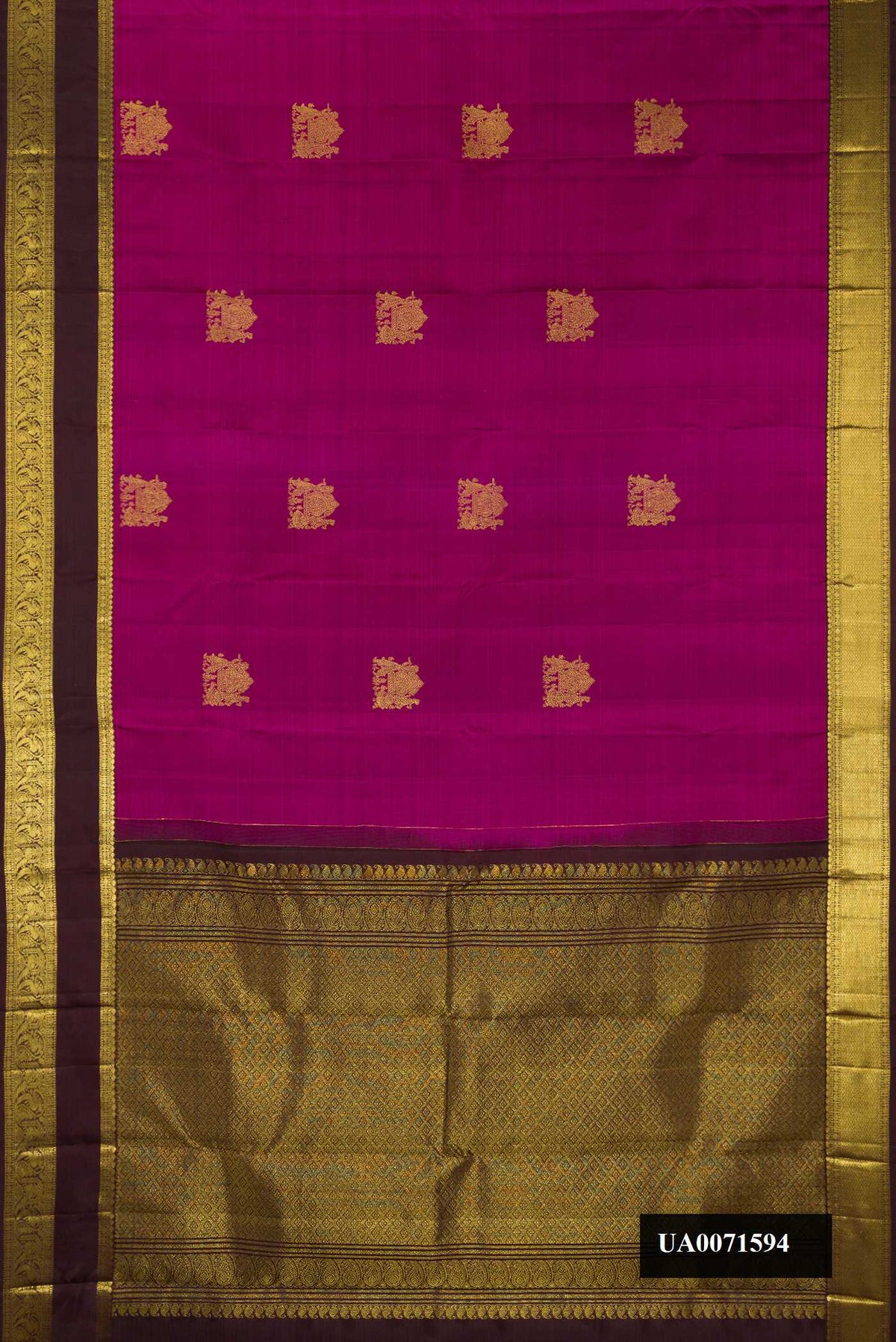 Magenta Dual Tone Kanchipuram Silk Saree with Zari Butta on the body and Zari Border.  displayed on a mannequin