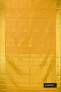 Gold Dual Tone Kanchipuram Silk Saree with Zari Butta on the body and Zari Border.  displayed on a mannequin