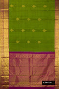 Green Dual Tone Kanchipuram Silk Saree with Zari Butta on the body and Zari Border.  displayed on a mannequin