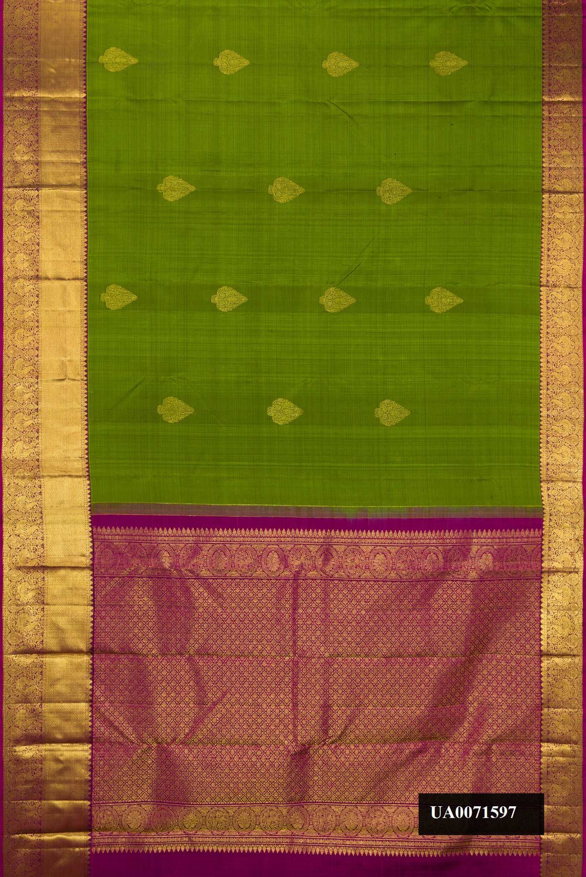 Green Dual Tone Kanchipuram Silk Saree with Zari Butta on the body and Zari Border.  displayed on a mannequin