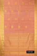 Rose Gold Dual Tone Kanchipuram Silk Saree with Zari Butta on the body and Zari Border.  displayed on a mannequin