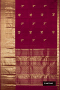 Maroon Dual Tone Kanchipuram Silk Saree with Zari Butta on the body and Fancy Border.  displayed on a mannequin