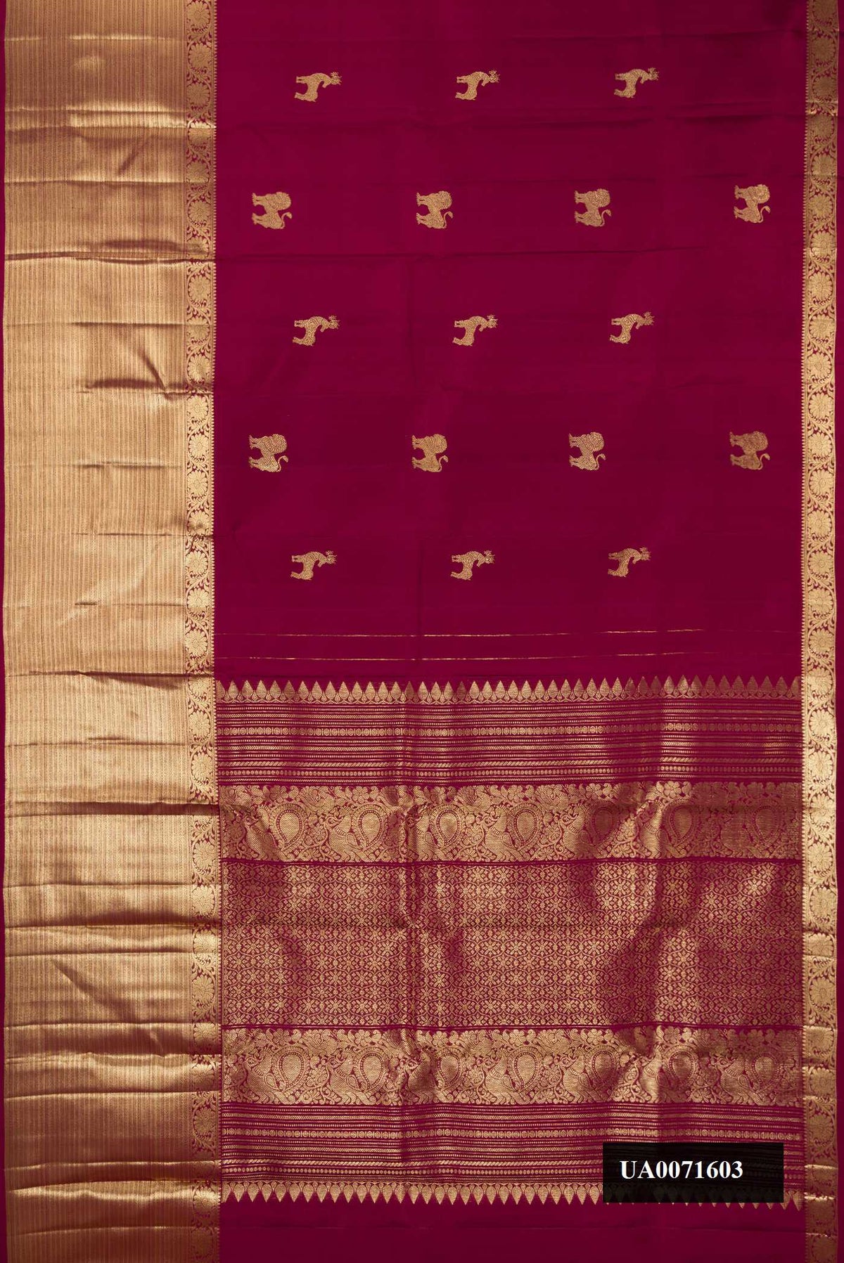 Maroon Dual Tone Kanchipuram Silk Saree with Zari Butta on the body and Fancy Border.  displayed on a mannequin