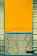 Yellow Dual Tone Kanchipuram Silk Saree with Zari Butta on the body and Zari Border.  displayed on a mannequin