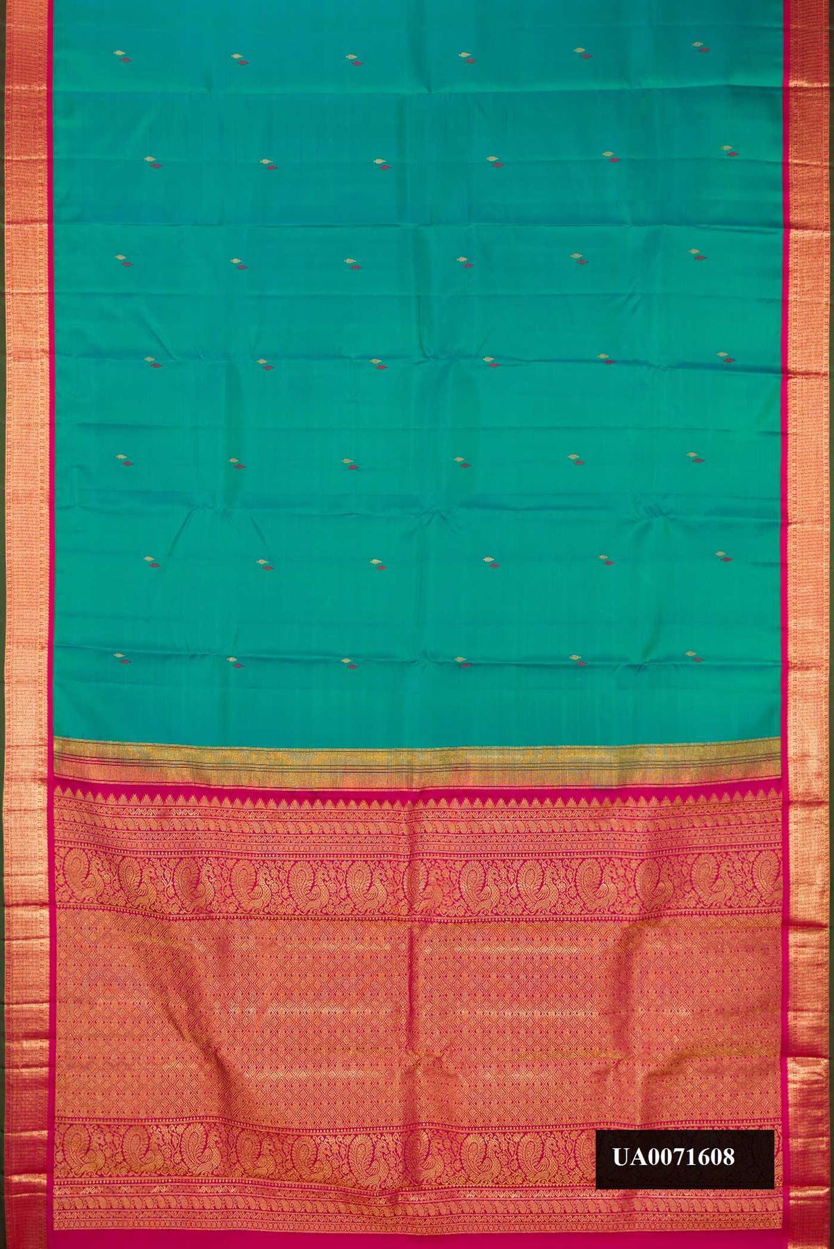 Peacock Blue Dual Tone Kanchipuram Silk Saree with Zari And Thread Butta on the body and Zari Border.  displayed on a mannequin