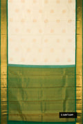 Sandal Dual Tone Kanchipuram Silk Saree with Zari Butta on the body and Zari Border.  displayed on a mannequin