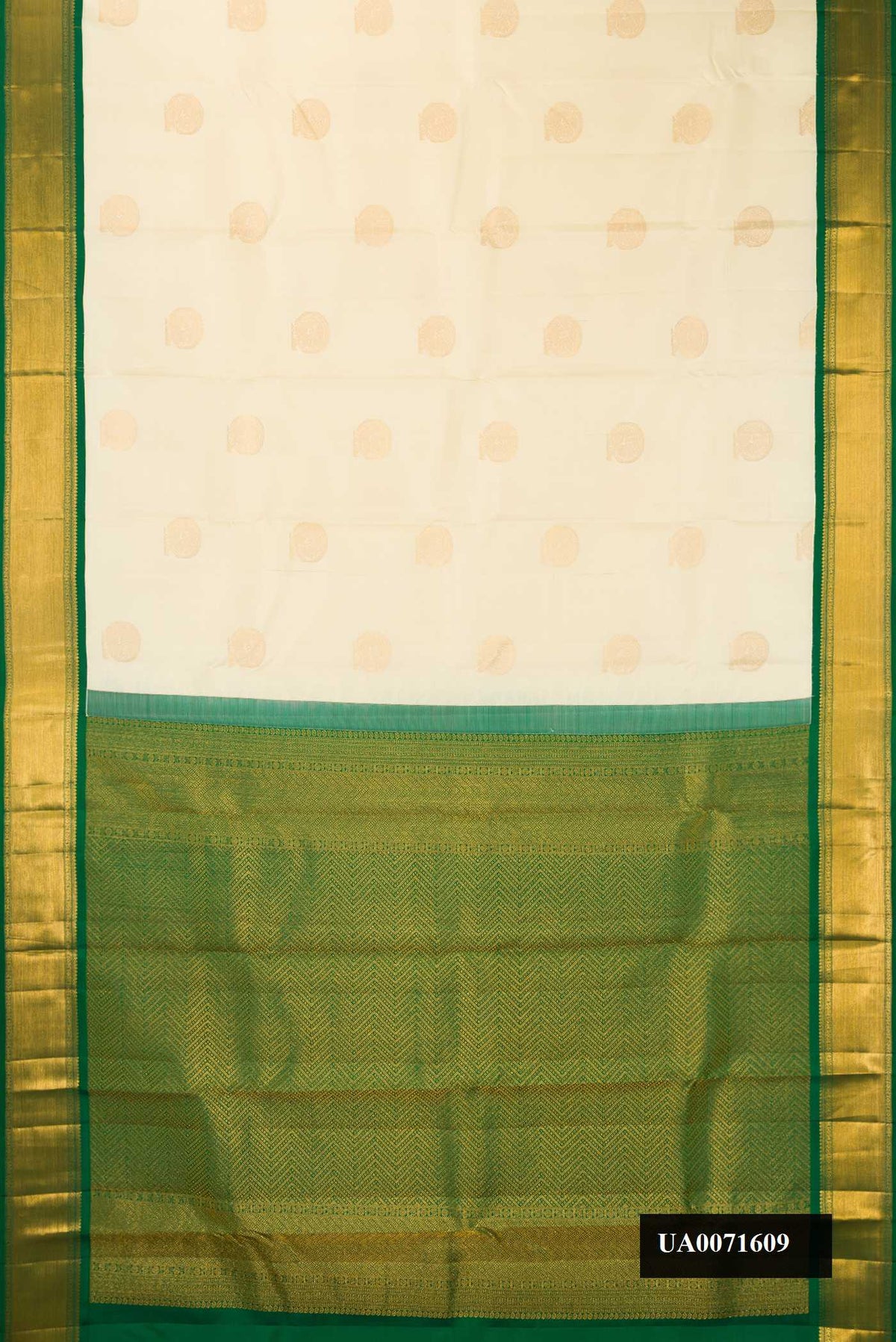 Sandal Dual Tone Kanchipuram Silk Saree with Zari Butta on the body and Zari Border.  displayed on a mannequin