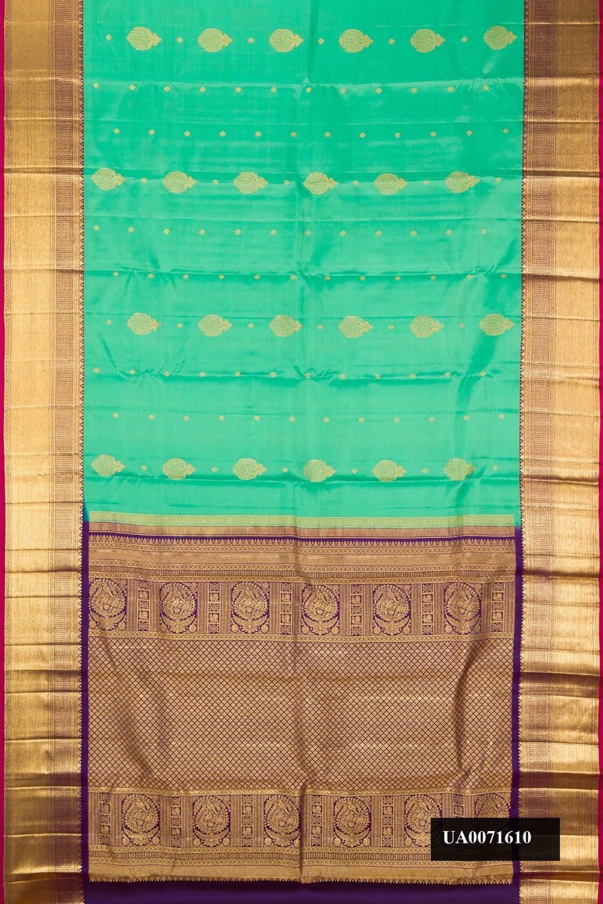 Sea Green Dual Tone Kanchipuram Silk Saree with Zari Butta on the body and Zari Border.  displayed on a mannequin