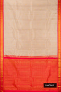 Beige Dual Tone Kanchipuram Silk Saree with Zari Butta on the body and Zari Border.  displayed on a mannequin