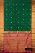 Bottle Green Dual Tone Kanchipuram Silk Saree with Zari Butta on the body and Zari Border.  displayed on a mannequin