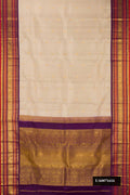 Dark Beige Dual Tone Kanchipuram Silk Saree with Zari Butta on the body and Zari Border.  displayed on a mannequin
