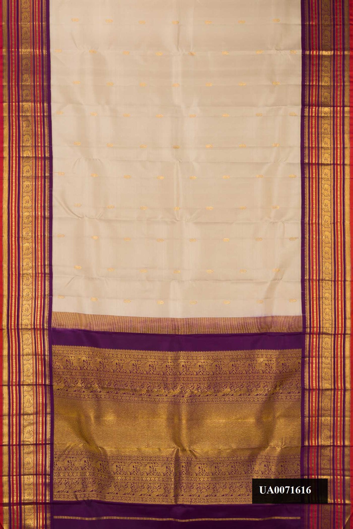 Dark Beige Dual Tone Kanchipuram Silk Saree with Zari Butta on the body and Zari Border.  displayed on a mannequin