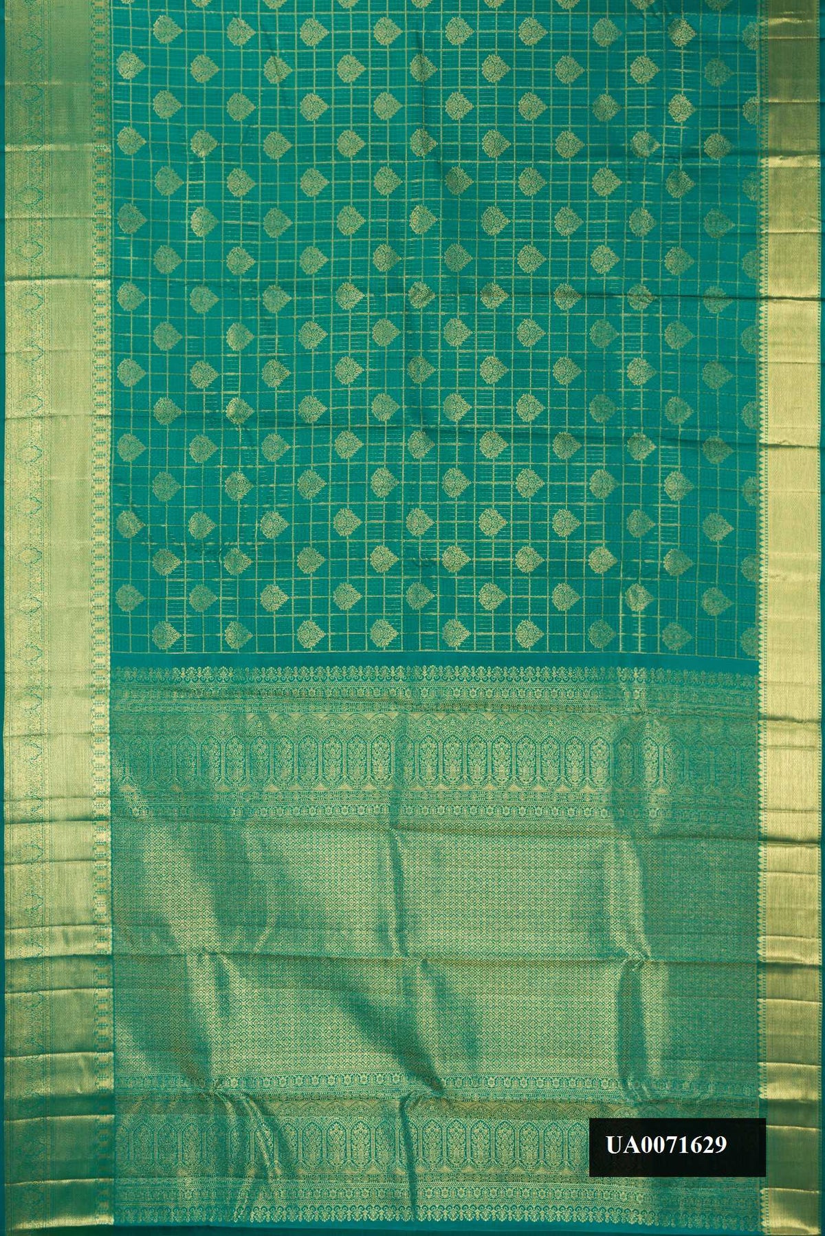 Green Dual Tone Kanchipuram Silk Saree with Checked design on the body and Zari Border.  displayed on a mannequin