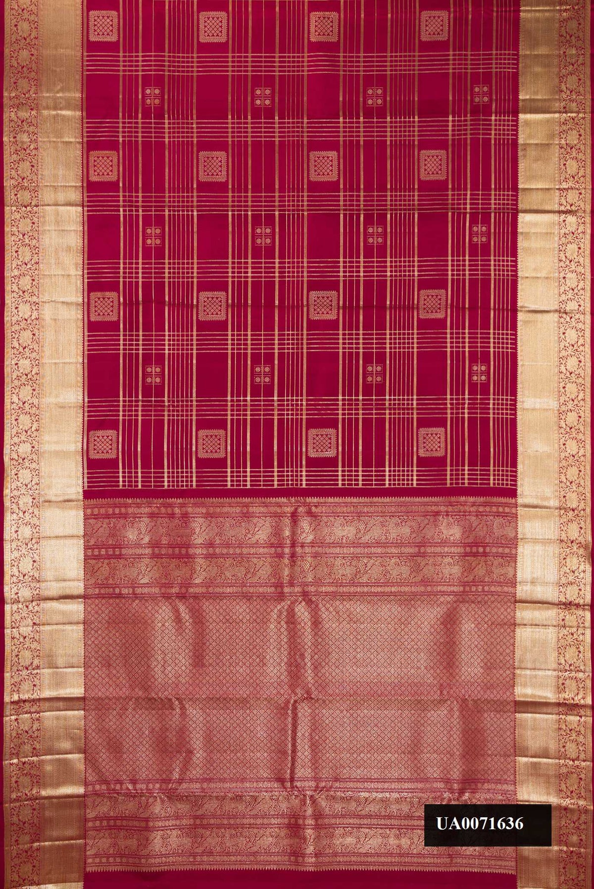 Maroon Dual Tone Kanchipuram Silk Saree with Checked design on the body and Zari Border.  displayed on a mannequin