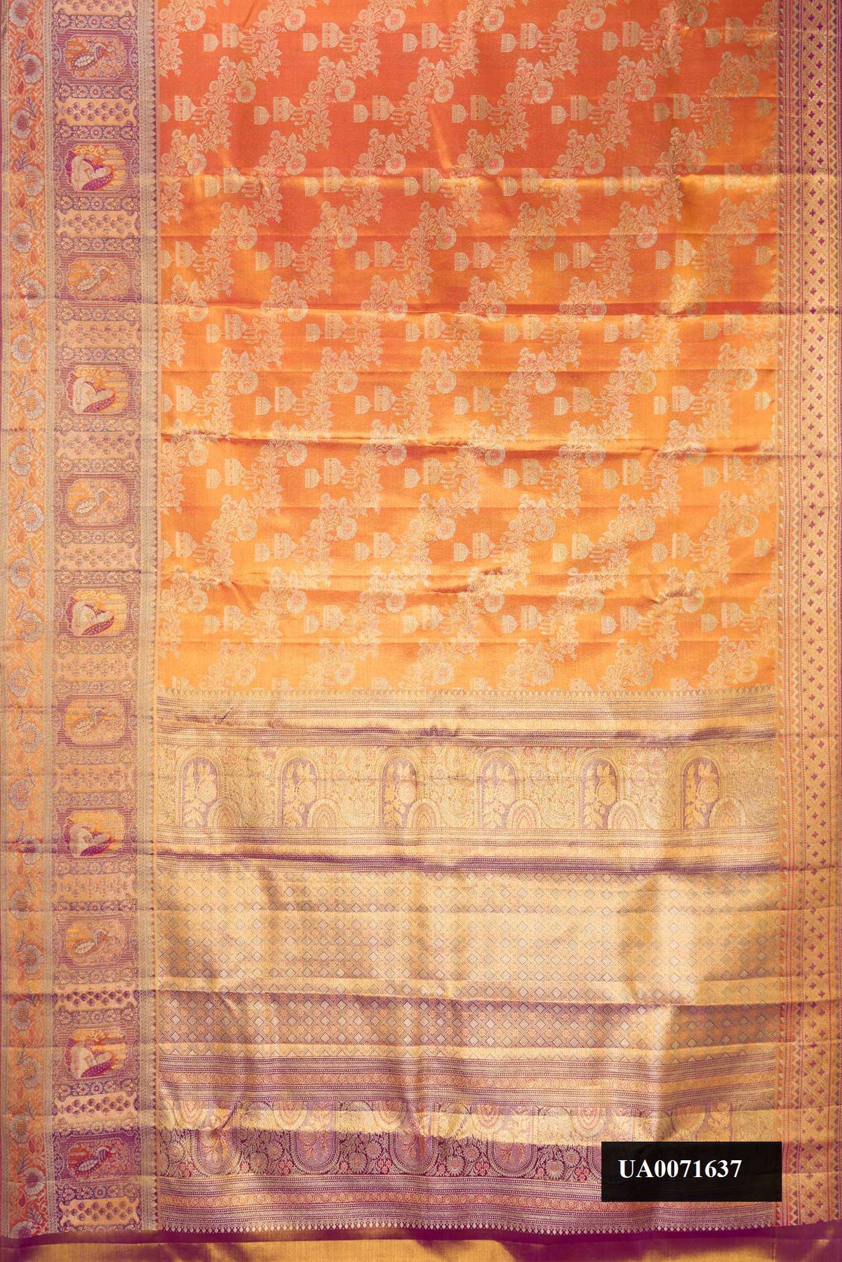 Orange Dual Tone Kanchipuram Tissue Silk Saree with Zari Brocade on the body and Fancy Border.  displayed on a mannequin