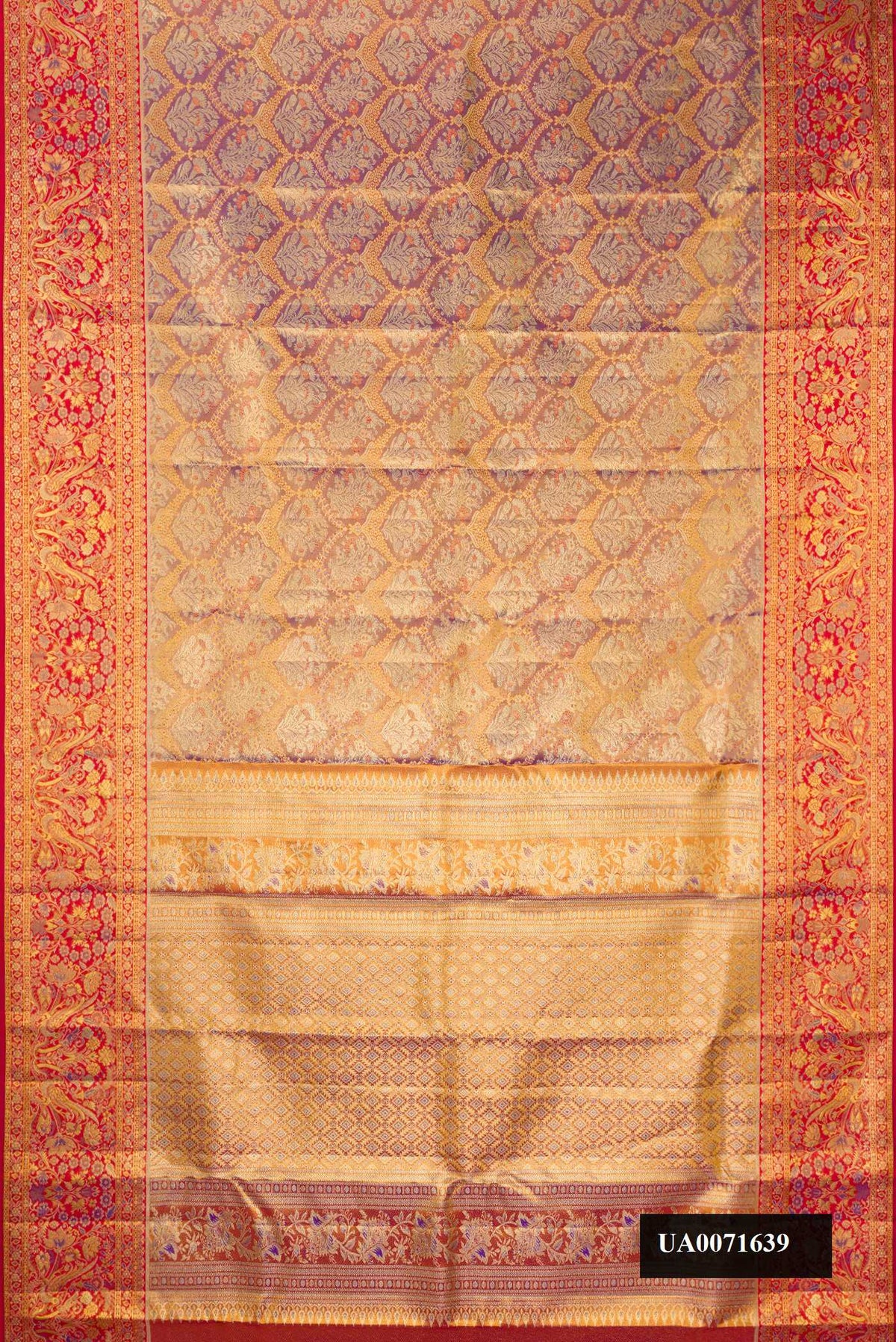 Gold Dual Tone Kanchipuram Tissue Silk Saree with Zari Brocade on the body and Fancy Border.  displayed on a mannequin